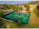 Aerial view of tennis courts surrounded by lush greenery at 23495 Bluestem Dr, Golden, CO 80401