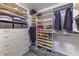 Spacious walk-in closet with built-in shelving and drawers, offering ample storage for clothing and accessories at 23495 Bluestem Dr, Golden, CO 80401