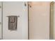 Clean bathroom featuring a tiled shower, towel rack, and modern fixtures at 8465 S Holland Way # 101, Littleton, CO 80128