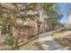 Condo exterior featuring well-maintained landscaping and a sidewalk at 8465 S Holland Way # 101, Littleton, CO 80128