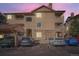 Exterior of a multi-story condo building featuring stone accents, balconies, and convenient parking at 8465 S Holland Way # 101, Littleton, CO 80128