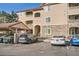 Exterior view of a condominium complex with parking at 8465 S Holland Way # 101, Littleton, CO 80128