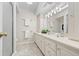 Modern bathroom featuring tiled floors, shower, and a built-in vanity at 3942 E Evans Ave, Denver, CO 80210