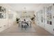 A dining room featuring new floors and large windows at 3942 E Evans Ave, Denver, CO 80210