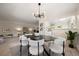 Open-concept dining space with direct access to the living room and kitchen at 3942 E Evans Ave, Denver, CO 80210