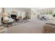 Spacious living room flowing into dining area with natural light at 3942 E Evans Ave, Denver, CO 80210