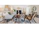 Bright living room featuring a decorative fireplace and modern furnishings at 3942 E Evans Ave, Denver, CO 80210