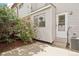Charming backyard patio space with a cozy seating area, and a lush garden at 12885 W Alameda Dr, Lakewood, CO 80228