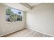 Bright bedroom with large window, hardwood floors, and neutral wall color at 12885 W Alameda Dr, Lakewood, CO 80228