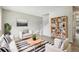 Stylishly staged living room with hardwood floors, comfortable seating, and bright natural light at 12885 W Alameda Dr, Lakewood, CO 80228