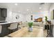 Inviting living space featuring dining table, kitchen island, and comfortable seating at 9340 Pierce St, Westminster, CO 80021