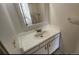 Simple bathroom vanity with a white countertop, sink, and a large mirror at 2281 S Vaughn Way # 118A, Aurora, CO 80014