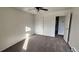 Modest bedroom features neutral walls, carpet, and an open closet at 2281 S Vaughn Way # 118A, Aurora, CO 80014