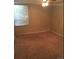 Bedroom showcasing neutral walls, carpet, and a window with blinds at 2281 S Vaughn Way # 118A, Aurora, CO 80014