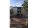 Building exterior featuring well-maintained facade and brick pathway at 2281 S Vaughn Way # 118A, Aurora, CO 80014