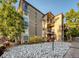 Exterior shot of apartment complex with white rock landscaping at 2281 S Vaughn Way # 118A, Aurora, CO 80014