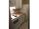Functional kitchen featuring basic appliances and ample cabinet storage at 2281 S Vaughn Way # 118A, Aurora, CO 80014