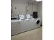 Community laundry room featuring multiple washing machines and dryers at 2281 S Vaughn Way # 118A, Aurora, CO 80014