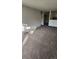 Large living room with plush carpeting and neutral wall colors at 2281 S Vaughn Way # 118A, Aurora, CO 80014