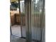 Private outdoor patio area with wooden fence and sliding glass door at 2281 S Vaughn Way # 118A, Aurora, CO 80014