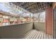 Outdoor balcony with wood decking and neighborhood views at 3050 W 32Nd Ave # 102C, Denver, CO 80211