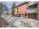 Exterior view of a multi-Gathering building with multiple garages and parking at 3050 W 32Nd Ave # 102C, Denver, CO 80211