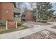 Brick multi-Gathering building with a Highland Park sign, trees, and landscaping at 3050 W 32Nd Ave # 102C, Denver, CO 80211