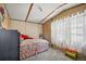 Cozy bedroom with plush bedding and soft natural light from the two windows at 422 Willow Dr, Lochbuie, CO 80603