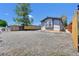 Image showing a light blue sided house with gravel landscaping, a small bay window, and wood fence at 422 Willow Dr, Lochbuie, CO 80603