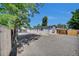 Charming single-story home featuring light blue siding, gravel landscaping, and a detached building at 422 Willow Dr, Lochbuie, CO 80603