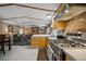Bright kitchen showcasing stainless steel gas range and wood cabinets with modern decor at 422 Willow Dr, Lochbuie, CO 80603