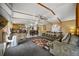 Spacious living room offers modern decor with open concept kitchen and dining area at 422 Willow Dr, Lochbuie, CO 80603