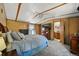 Bedroom features a ceiling fan and a TV at 422 Willow Dr, Lochbuie, CO 80603