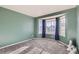 Cozy bedroom featuring a bay window, plush carpet, and soft, natural light at 17045 Hastings Ave, Parker, CO 80134