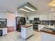 Bright kitchen featuring stainless steel appliances, tile floors and counter tops at 17045 Hastings Ave, Parker, CO 80134