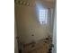 Bathroom featuring a window, shower curtain, and vintage lighting at 3811 Lisbon Ct, Denver, CO 80249