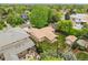 Aerial view of a home featuring a spacious backyard, detached garage, and covered patio at 3444 S Bellaire St, Denver, CO 80222