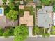 Bird's eye view of the home with a well-manicured yard, detached garage, and proximity to neighboring houses at 3444 S Bellaire St, Denver, CO 80222
