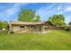 Inviting backyard showcasing a covered patio and a lush green lawn perfect for outdoor enjoyment at 3444 S Bellaire St, Denver, CO 80222