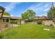 Expansive backyard featuring a detached garage and well-maintained landscaping, creating a serene outdoor space at 3444 S Bellaire St, Denver, CO 80222