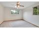 Bedroom with carpet, ceiling fan, and two windows at 3444 S Bellaire St, Denver, CO 80222