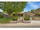 Charming brick home features a landscaped front yard with mature trees, a walkway, and an attached garage at 3444 S Bellaire St, Denver, CO 80222