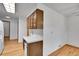 View of the kitchen featuring wood cabinets and a white countertop at 3444 S Bellaire St, Denver, CO 80222