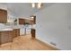 Charming kitchen with wood cabinets, white appliances, and hardwood floors at 3444 S Bellaire St, Denver, CO 80222