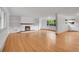 Bright living room showcases hardwood floors, a white stone fireplace, and built in cabinets at 3444 S Bellaire St, Denver, CO 80222