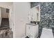 Chic half bathroom featuring modern fixtures, stylish tile accents, and contemporary vanity at 3611 S Perth Cir # 103, Aurora, CO 80013