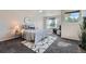 Bright bedroom featuring a comfortable bed, large window, and cozy decor at 3611 S Perth Cir # 103, Aurora, CO 80013