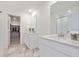 Main bathroom with double vanity and walk-in shower at 46545 Orchard Dr, Bennett, CO 80102