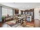 Open dining area with a stylish area rug next to the gourmet kitchen at 25843 E Archer Dr, Aurora, CO 80018