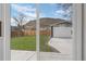 View of backyard, garage, and mountain from sliding glass door at 18866 W 59Th Pl, Golden, CO 80403